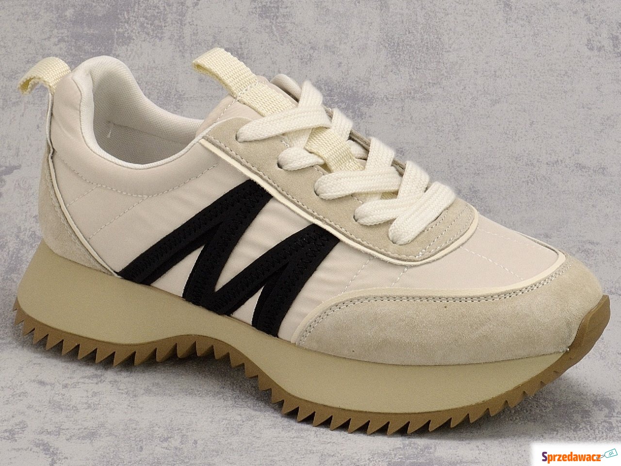 Beżowe skórzane sneakersy damskie...