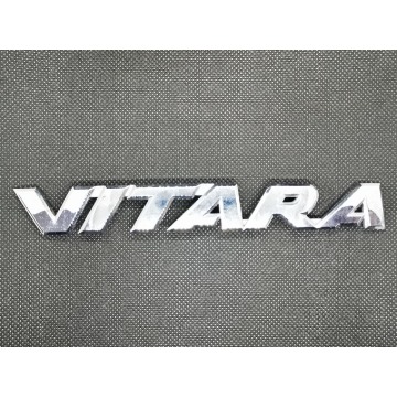 Emblemat napis Suzuki Vitara III LY 77831-54P00 - Pozostałe części - Warszawa - zdjęcie 1