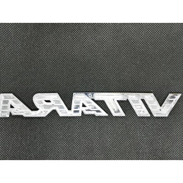 Emblemat napis Suzuki Vitara III LY 77831-54P00 - Pozostałe części - Warszawa - zdjęcie 2